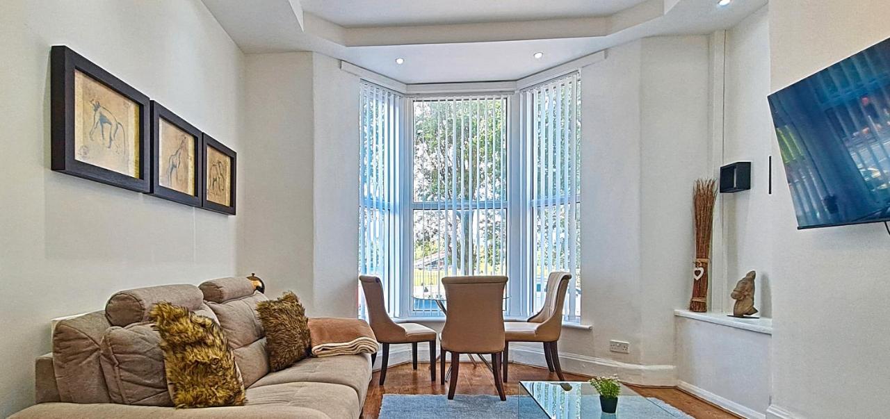 a living room with a couch and a table at Sidemersey Livings - Botanic Residence in Liverpool
